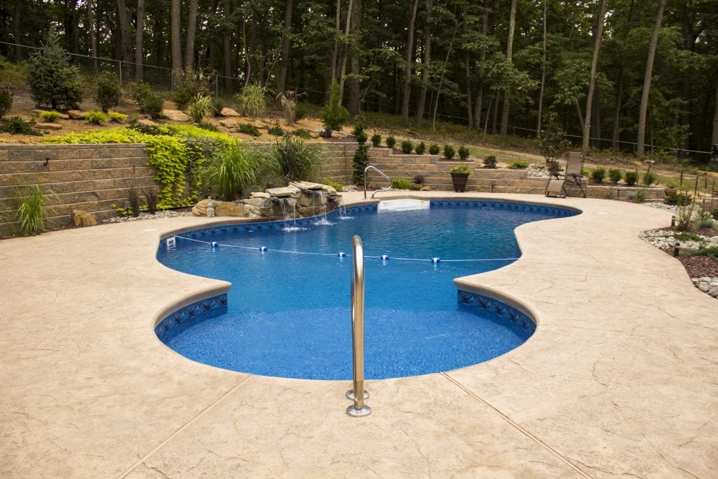 Blue Lagoon with waterfall and Architectural Stamped Concrete